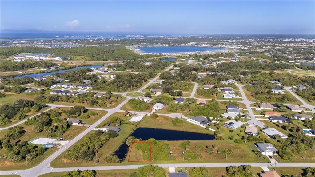 155 Spring Drive Rotonda West, FL 33947 - Photo 5 of 12 an aerial view of residential houses with outdoor space