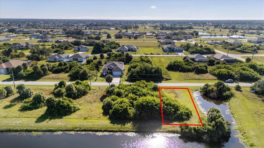 155 Spring Drive Rotonda West, FL 33947 - Photo 6 of 12 an aerial view of residential houses with outdoor space