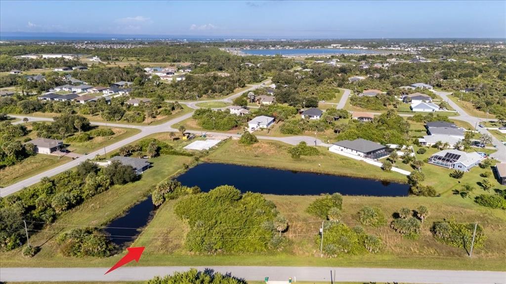 155 Spring Drive Rotonda West, FL 33947 - Photo 9 of 12 an aerial view of residential houses with outdoor space
