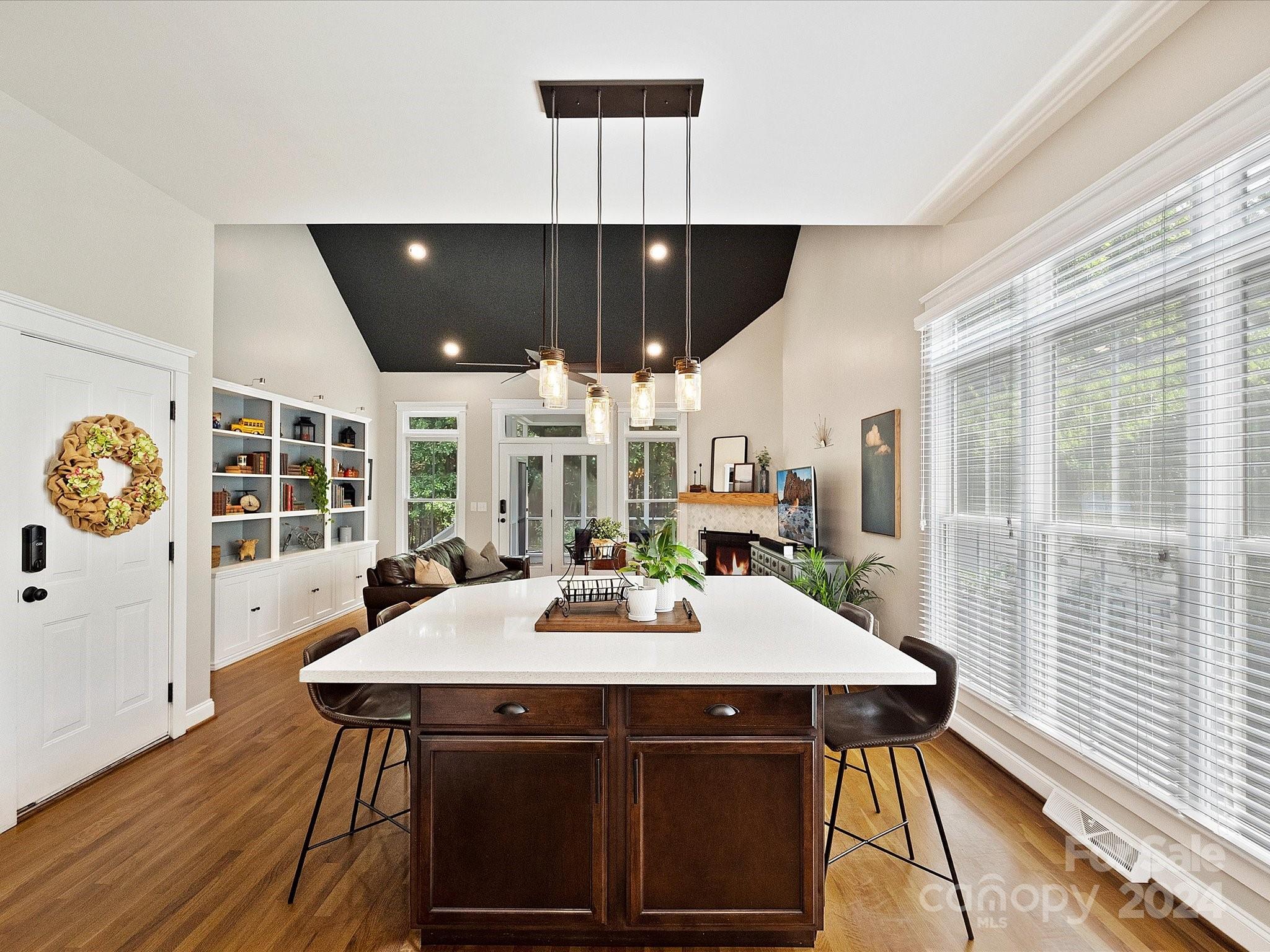 7132 Michael Scott Crossing Fort Mill, SC 29708 - Photo 15 of 41 a view of a dining room with furniture window and wooden floor