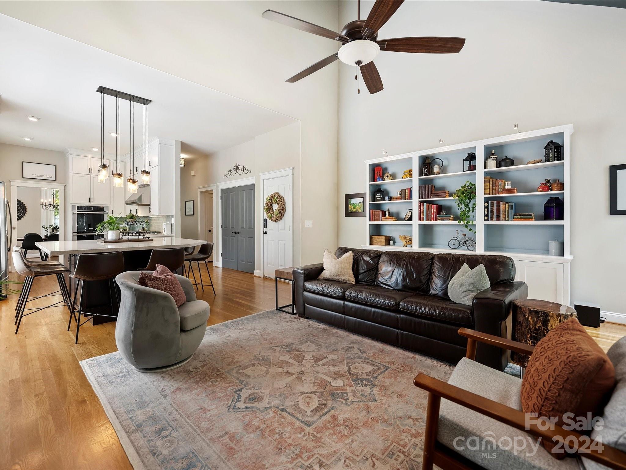 7132 Michael Scott Crossing Fort Mill, SC 29708 - Photo 19 of 41 a living room with furniture a rug and white walls