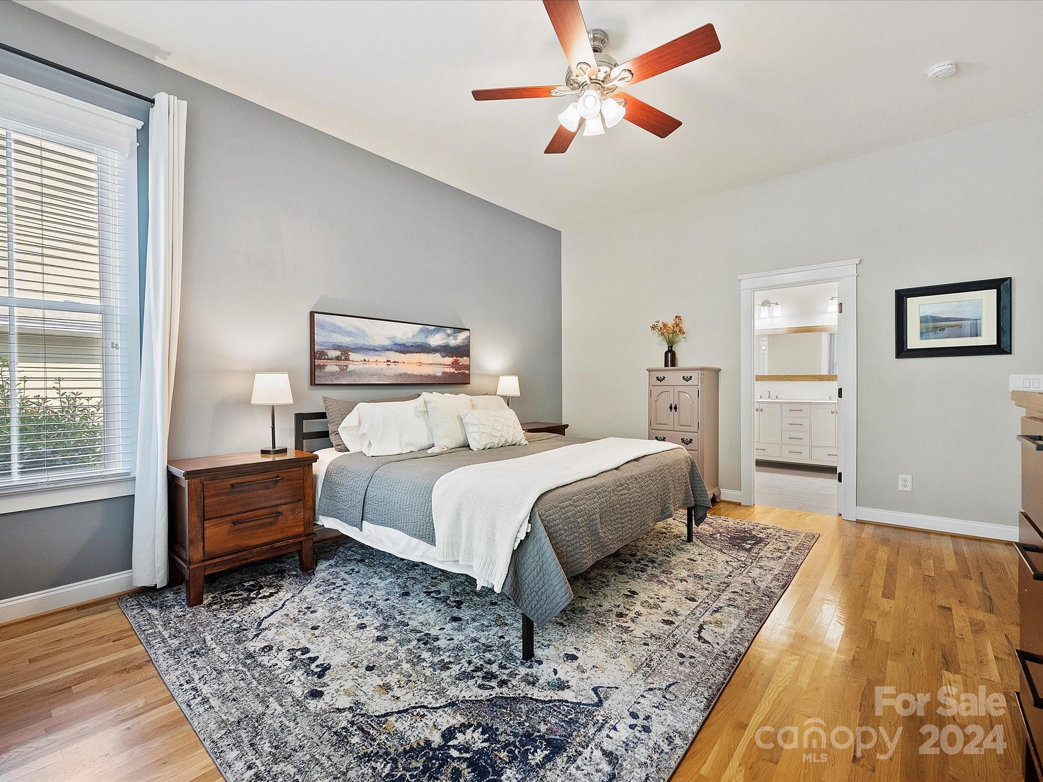 7132 Michael Scott Crossing Fort Mill, SC 29708 - Photo 23 of 41 a bedroom with a bed and a chandelier