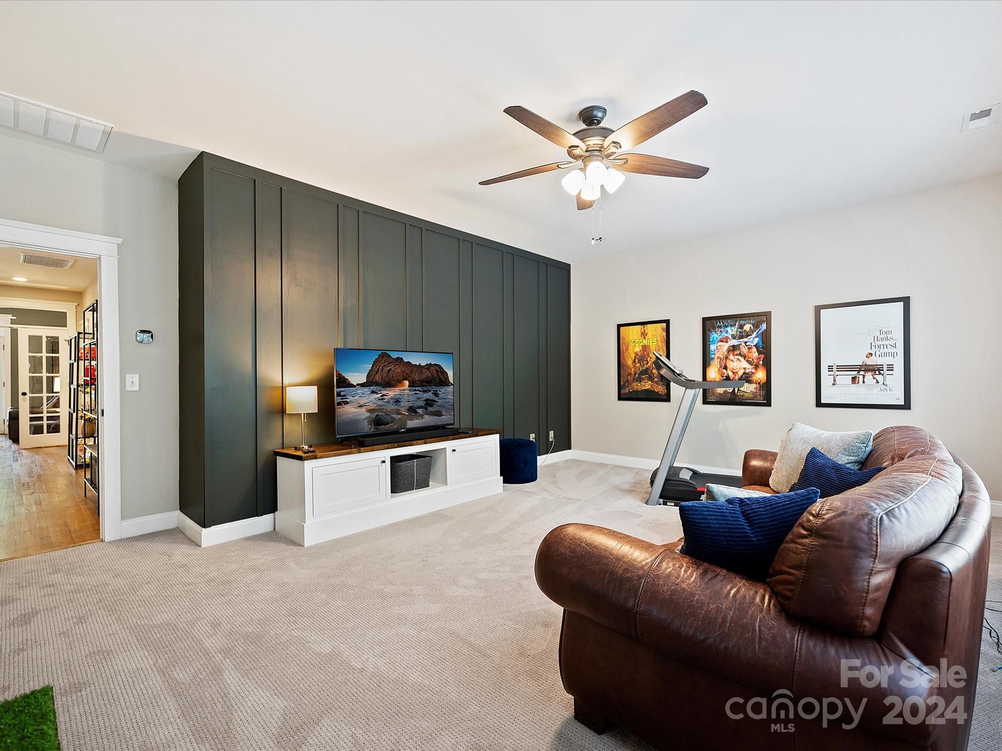 7132 Michael Scott Crossing Fort Mill, SC 29708 - Photo 34 of 41 a living room with furniture and a chandelier