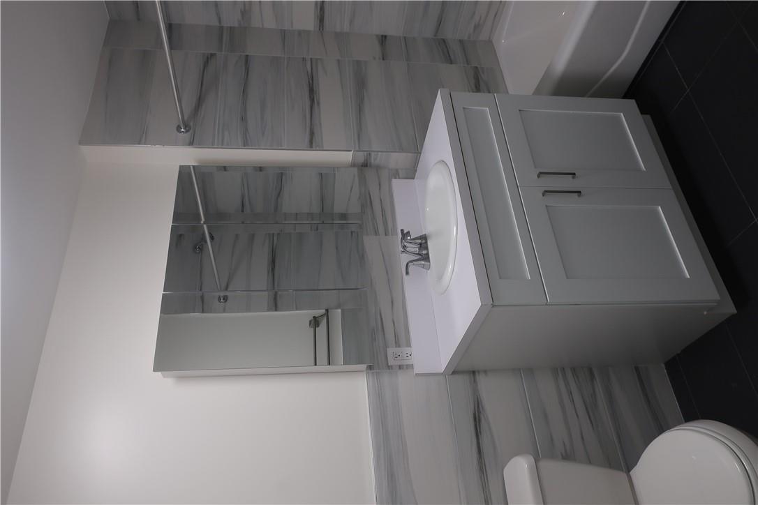 4203 Corner Spring Valley, NY 10977 - Photo 11 of 18 a bathroom with a sink toilet vanity and tub