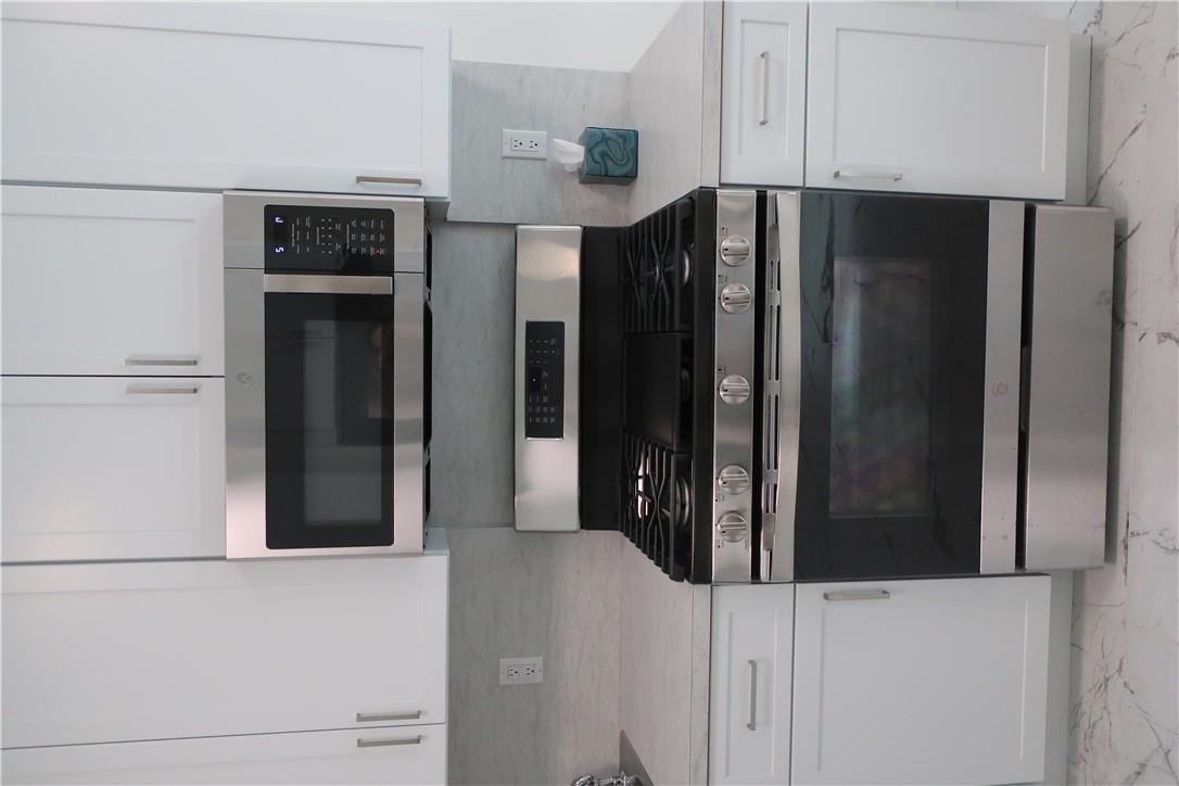 4203 Corner Spring Valley, NY 10977 - Photo 4 of 18 a stove top oven sitting inside of a kitchen