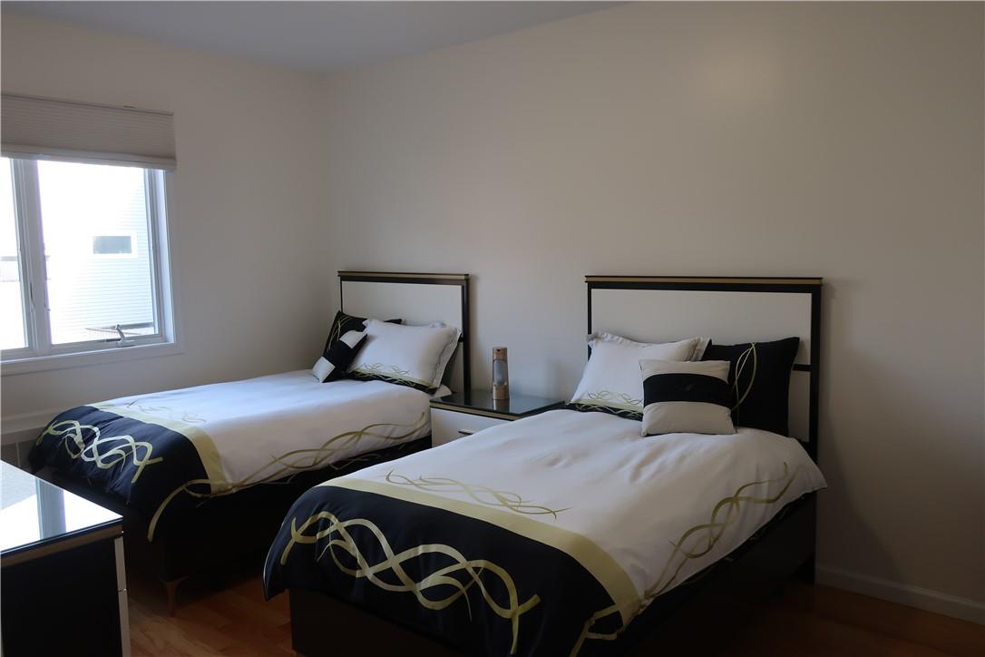 4203 Corner Spring Valley, NY 10977 - Photo 6 of 18 a bedroom with two beds and wooden floor