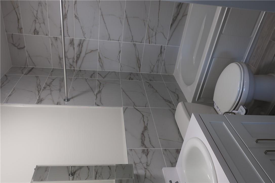 4203 Corner Spring Valley, NY 10977 - Photo 9 of 18 a bathroom with a toilet and a sink