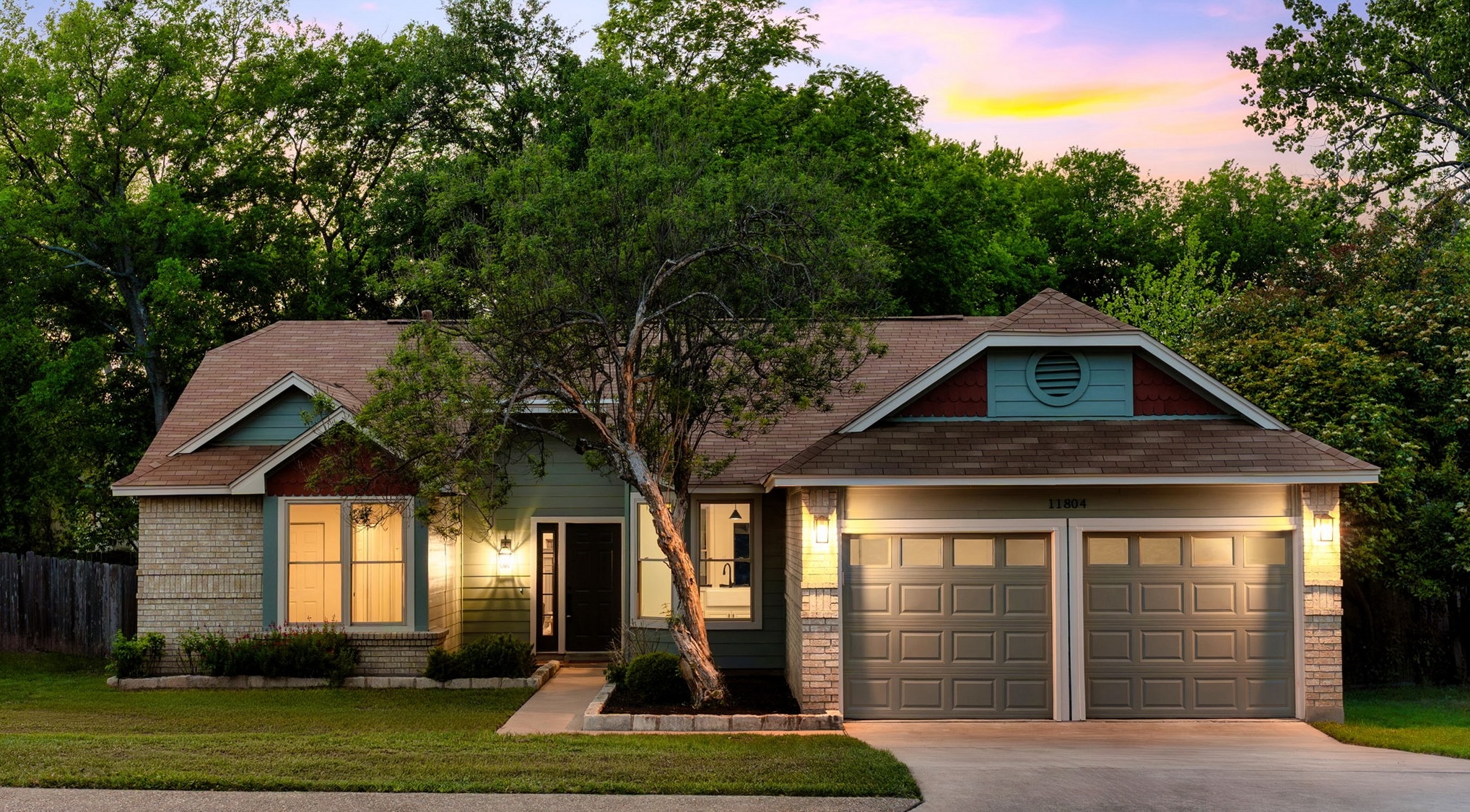 11804 Prairie Hen Lane Austin, TX 78758 - Photo 1 of 1 Craftsman-style house with driveway and a garage