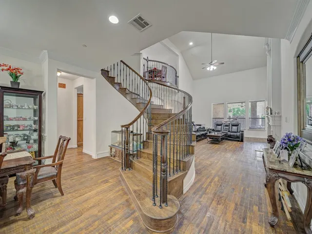 a view of a livingroom with furniture and hardwood floor