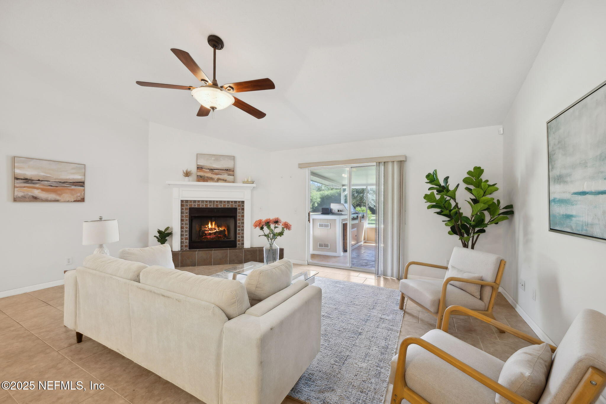36 Currant Avenue Middleburg, FL 32068 - Photo 12 of 59 a living room with furniture and a fireplace