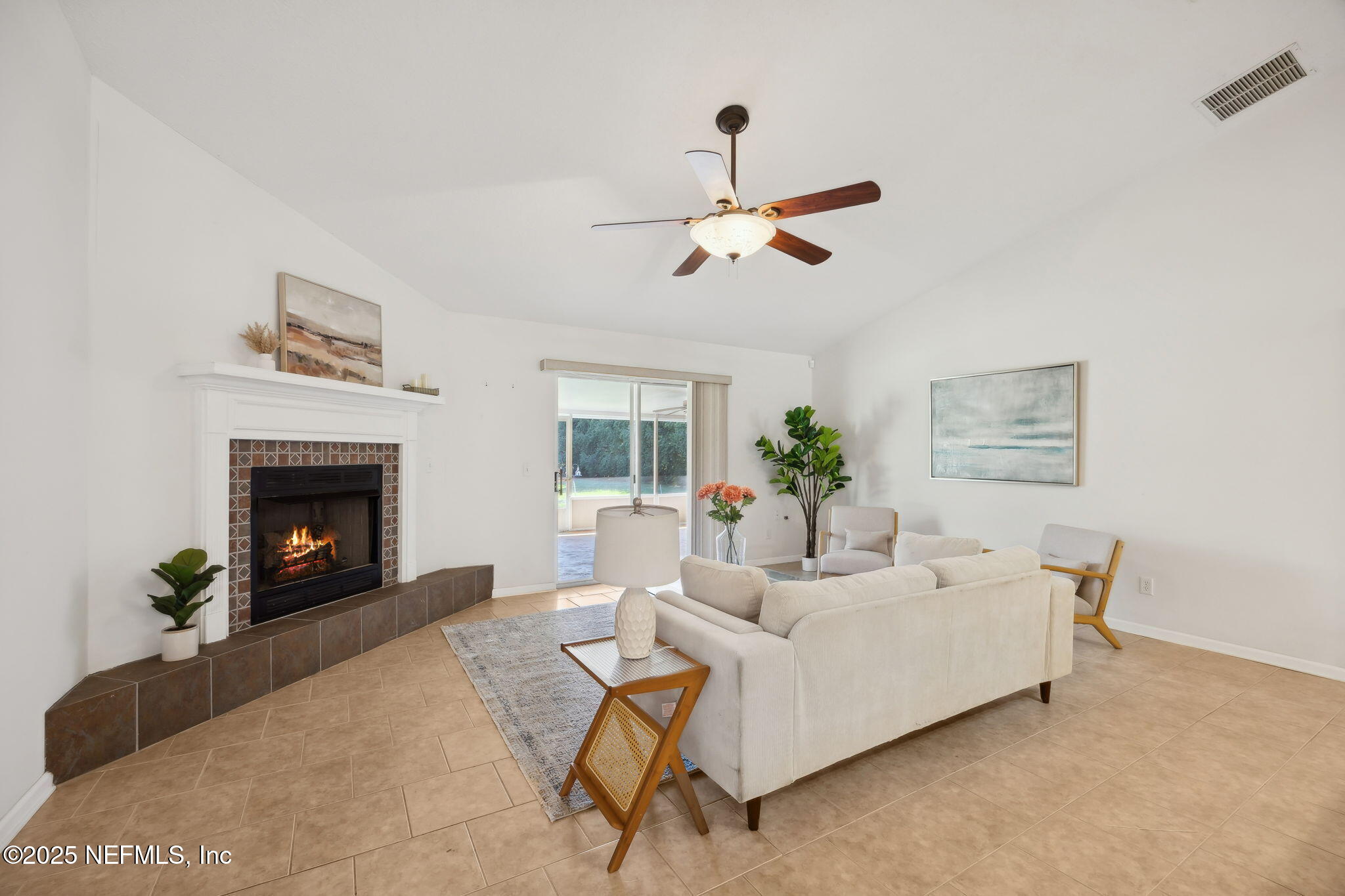 36 Currant Avenue Middleburg, FL 32068 - Photo 13 of 59 a living room with furniture and a fireplace