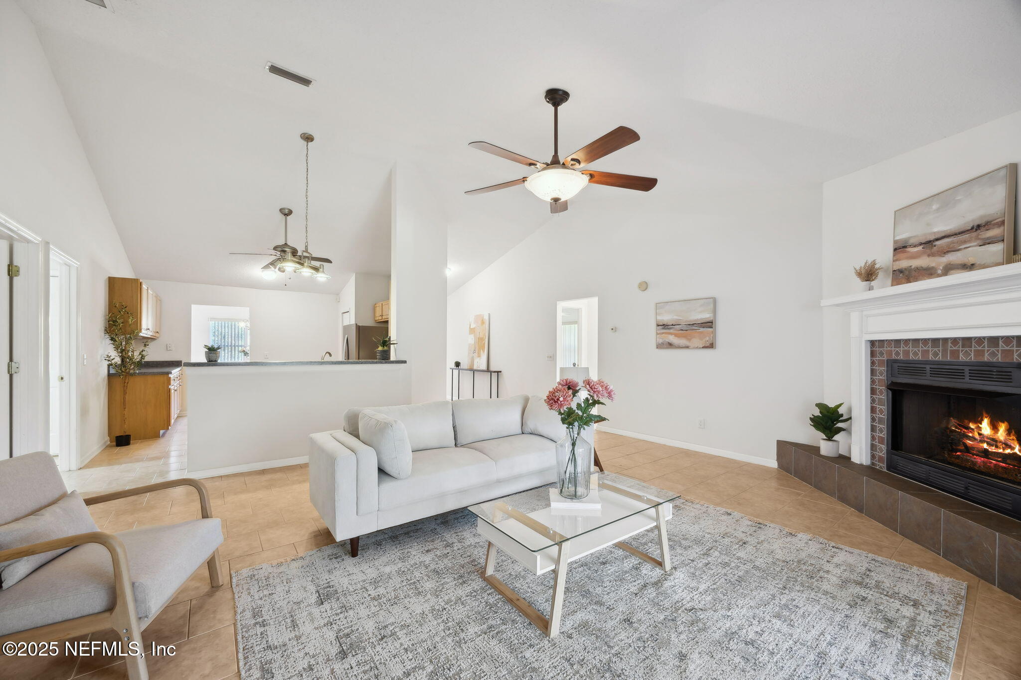 36 Currant Avenue Middleburg, FL 32068 - Photo 15 of 59 a living room with furniture a fireplace and a chandelier