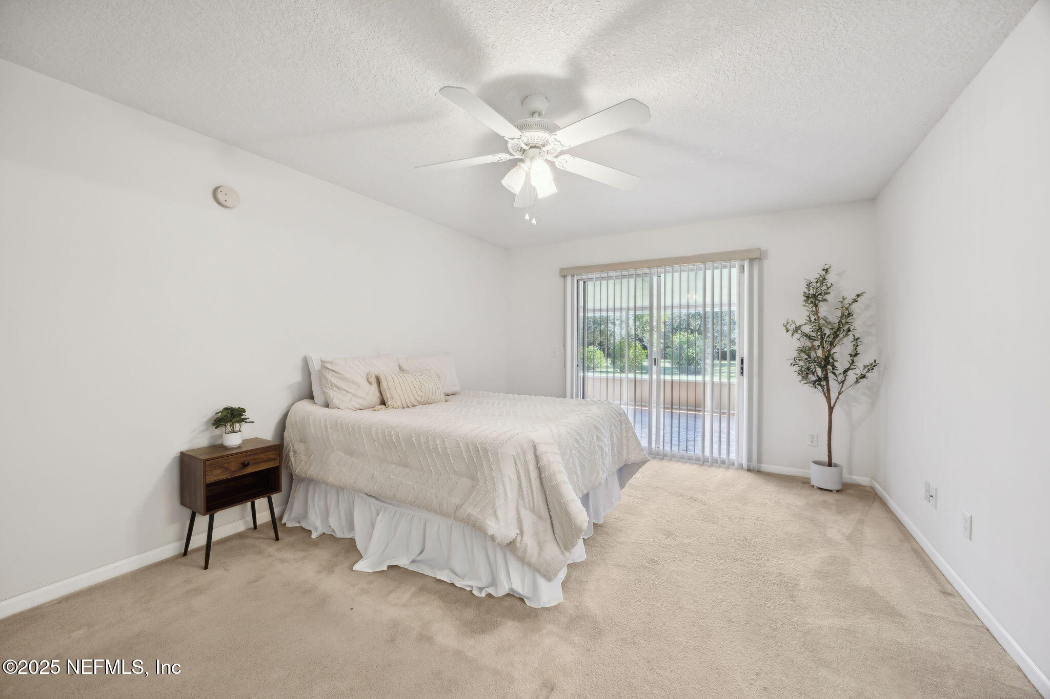 36 Currant Avenue Middleburg, FL 32068 - Photo 24 of 59 a spacious bedroom with a bed and a window