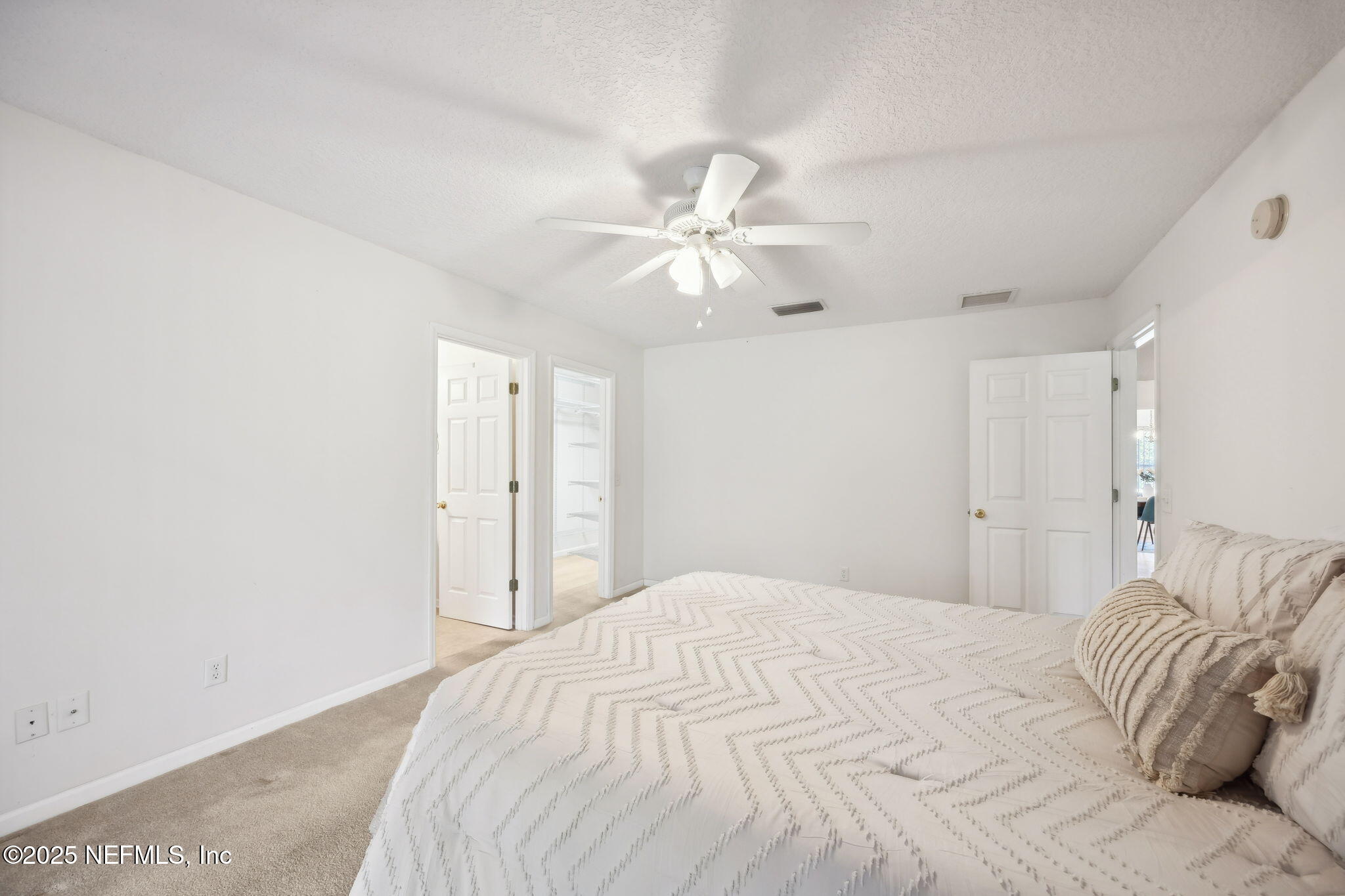 36 Currant Avenue Middleburg, FL 32068 - Photo 26 of 59 a bedroom with a bed and a ceiling fan