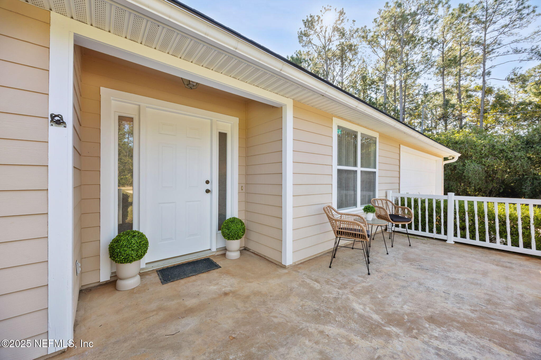 36 Currant Avenue Middleburg, FL 32068 - Photo 7 of 59 a view of a chair and table in backyard of the house