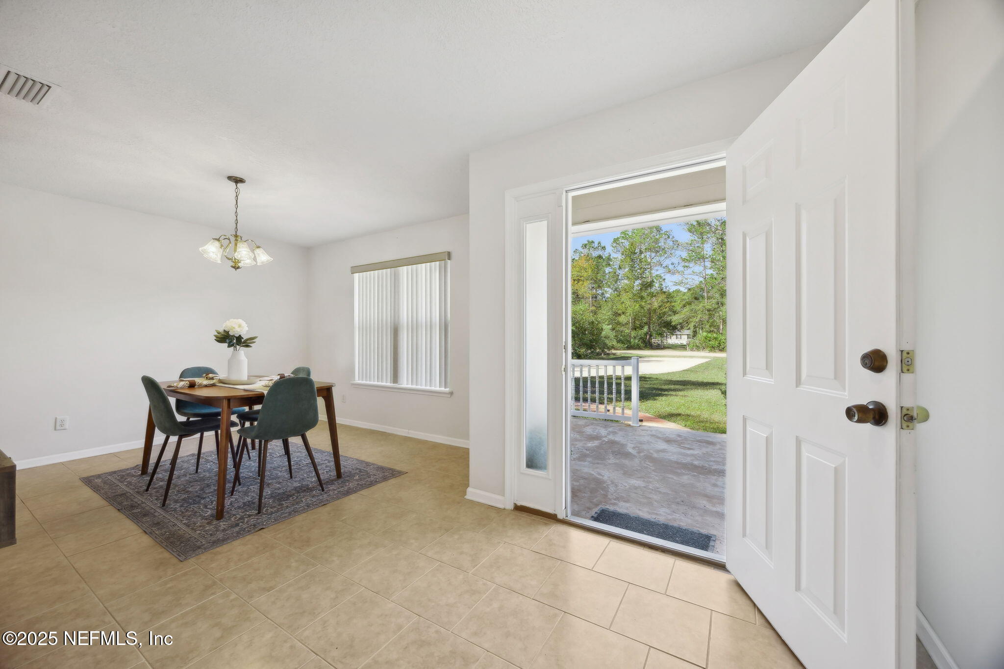 36 Currant Avenue Middleburg, FL 32068 - Photo 9 of 59 a dining room with furniture and window