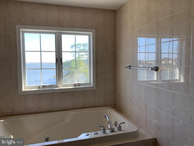 5 The Point Ocean Pines, MD 21811 - Photo 9 of 22 Primary bath whirlpool tub plus stall shower