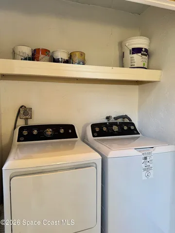 a utility room with dryer and washer