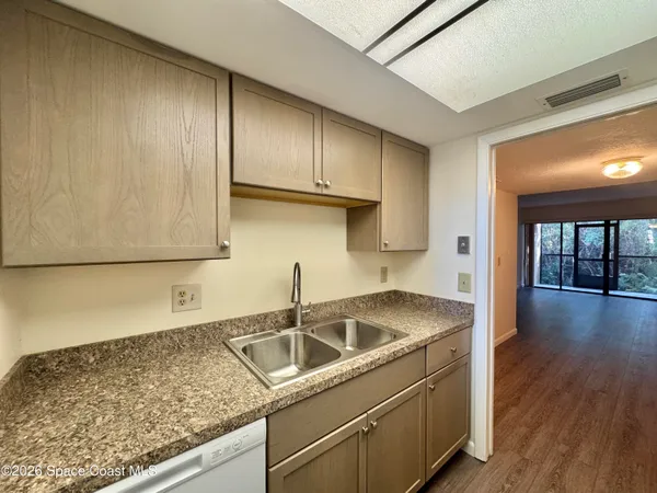a kitchen that has a sink and a stove