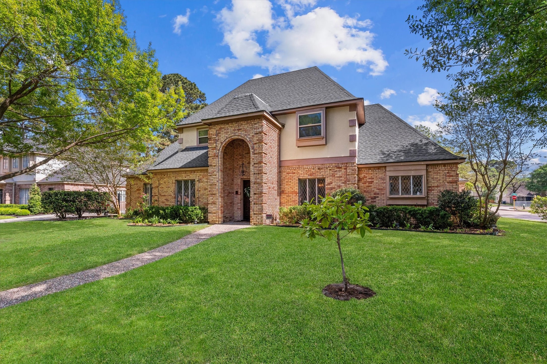 16267 Salmon Lane Spring, TX 77379 - Photo 2 of 48 Situated on a large corner lot with lovely oak trees, this home is also a prime neighborhood location at a quiet intersection, across from the neighborhood elementary school and playground.