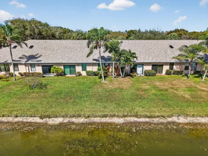 an aerial view of a house with a lake view