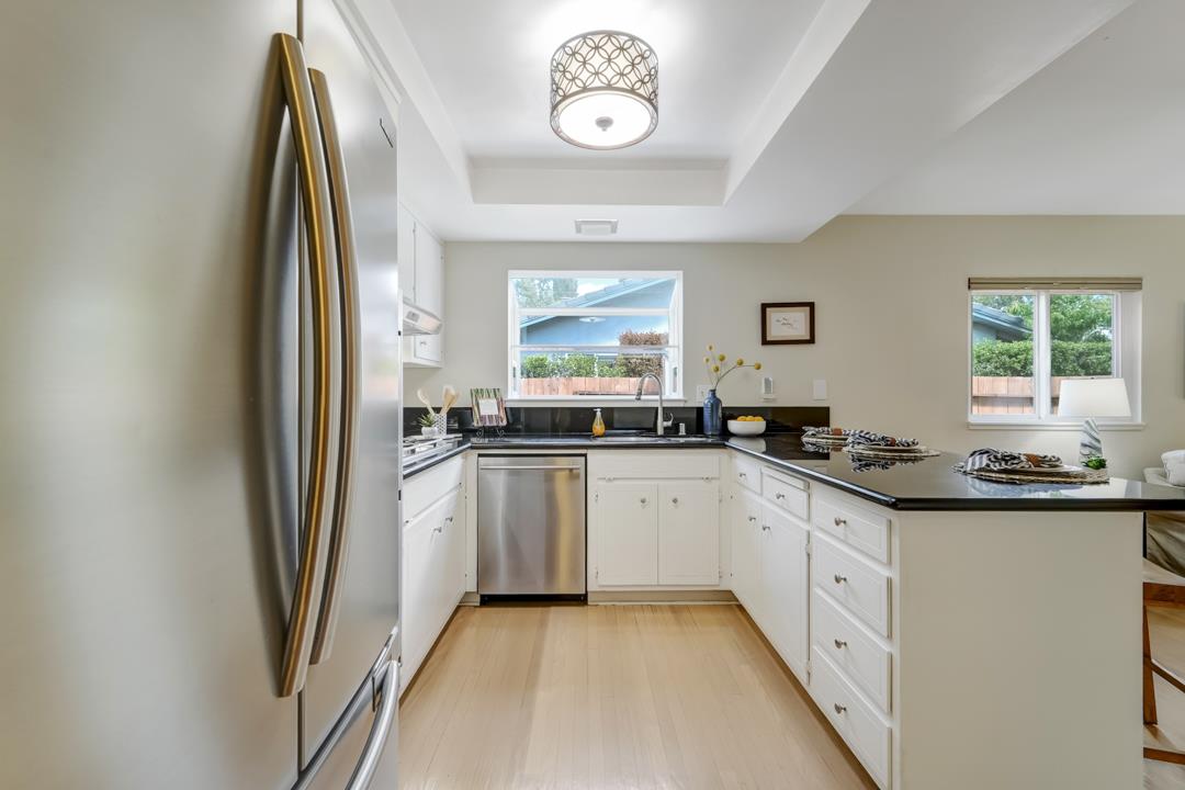 637 Laird Lane Lafayette, CA 94549 - Photo 14 of 44 a kitchen with granite countertop a sink stove and refrigerator