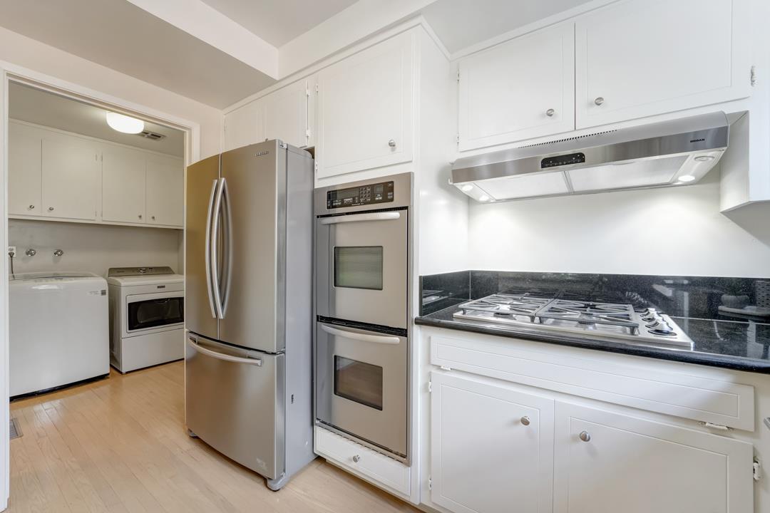 637 Laird Lane Lafayette, CA 94549 - Photo 16 of 44 a kitchen with white cabinets and stainless steel appliances