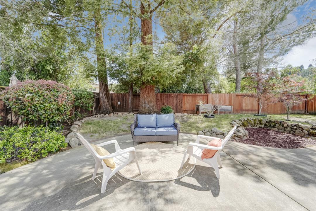637 Laird Lane Lafayette, CA 94549 - Photo 30 of 44 a view of a backyard with table and chairs potted plants and large tree