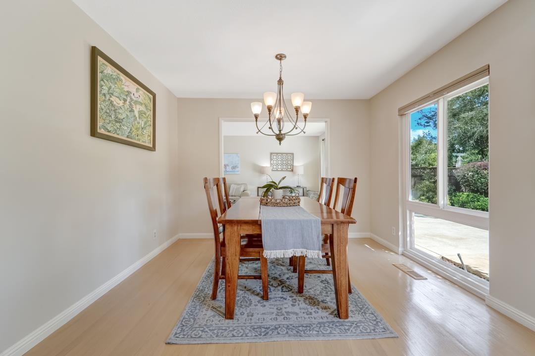 637 Laird Lane Lafayette, CA 94549 - Photo 8 of 44 a dining room with furniture a rug and a chandelier