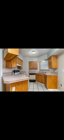 a view of a swimming pool and outdoor kitchen
