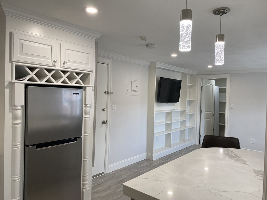 210 Hillside Avenue, Unit 37 Needham, MA 02494 - Photo 8 of 14 a kitchen with stainless steel appliances a refrigerator and a stove top oven