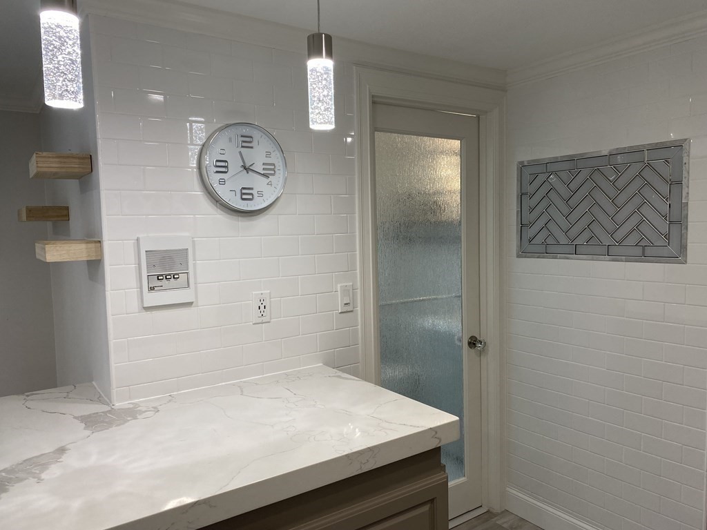 210 Hillside Avenue, Unit 37 Needham, MA 02494 - Photo 9 of 14 a view of bathroom with a sink and a mirror