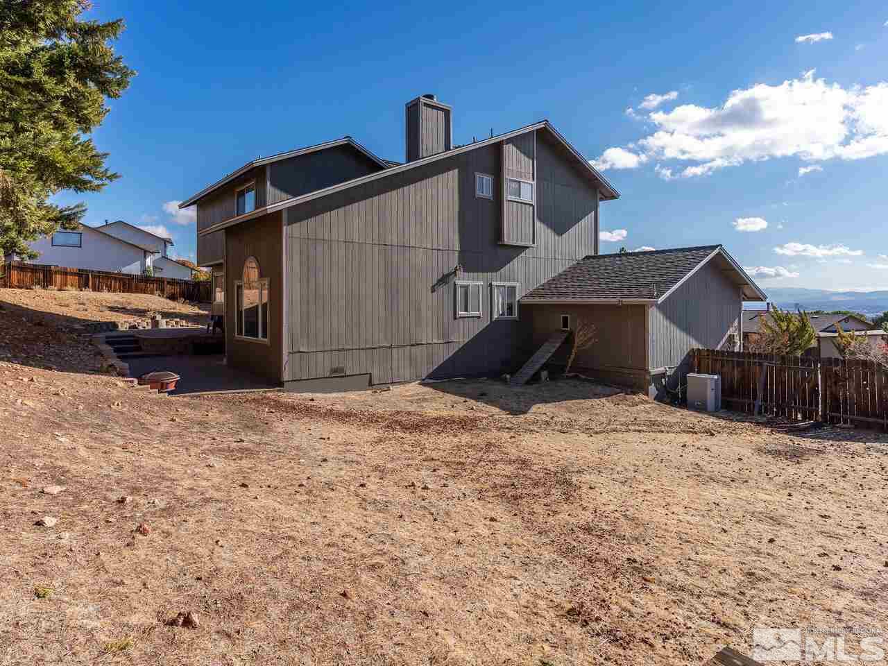 821 University Ridge Drive Reno, NV 89512 - Photo 27 of 28 a view of a house with a snow in the yard
