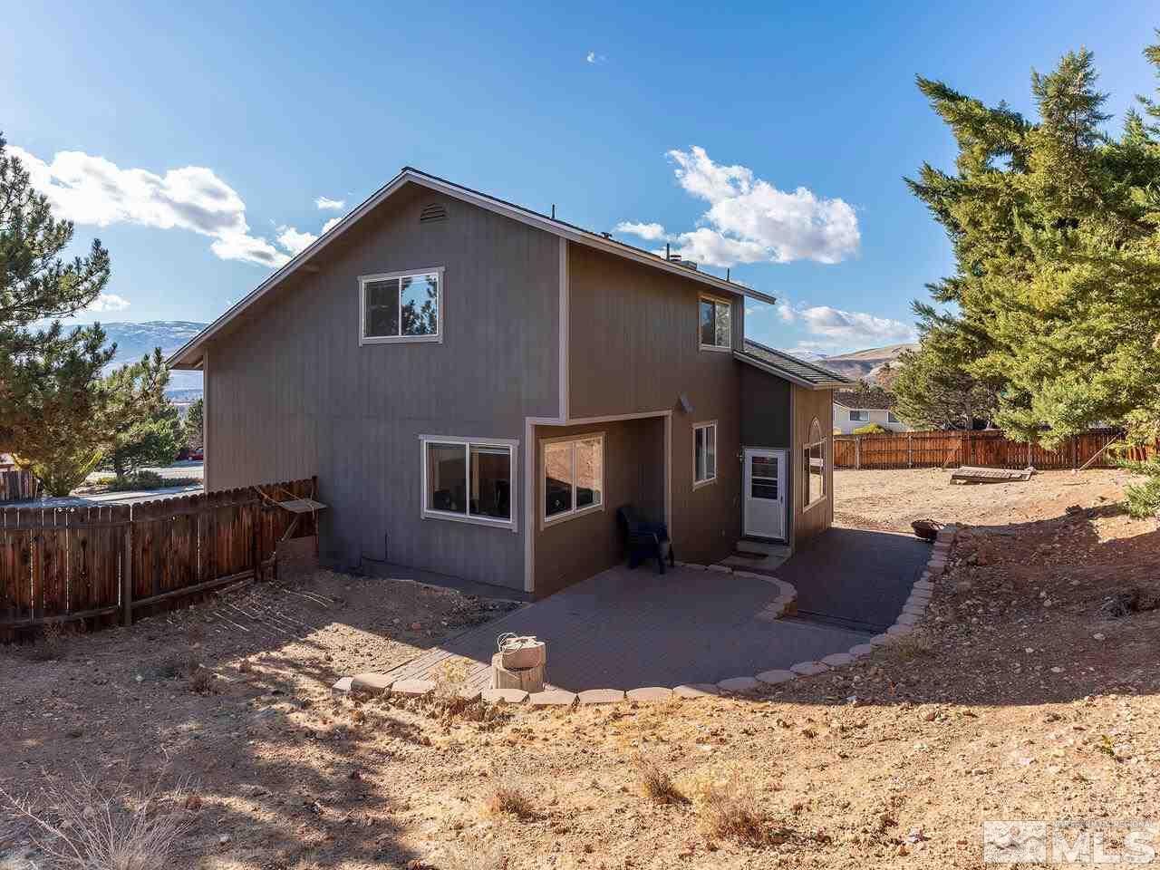 821 University Ridge Drive Reno, NV 89512 - Photo 28 of 28 a front view of a house with a yard