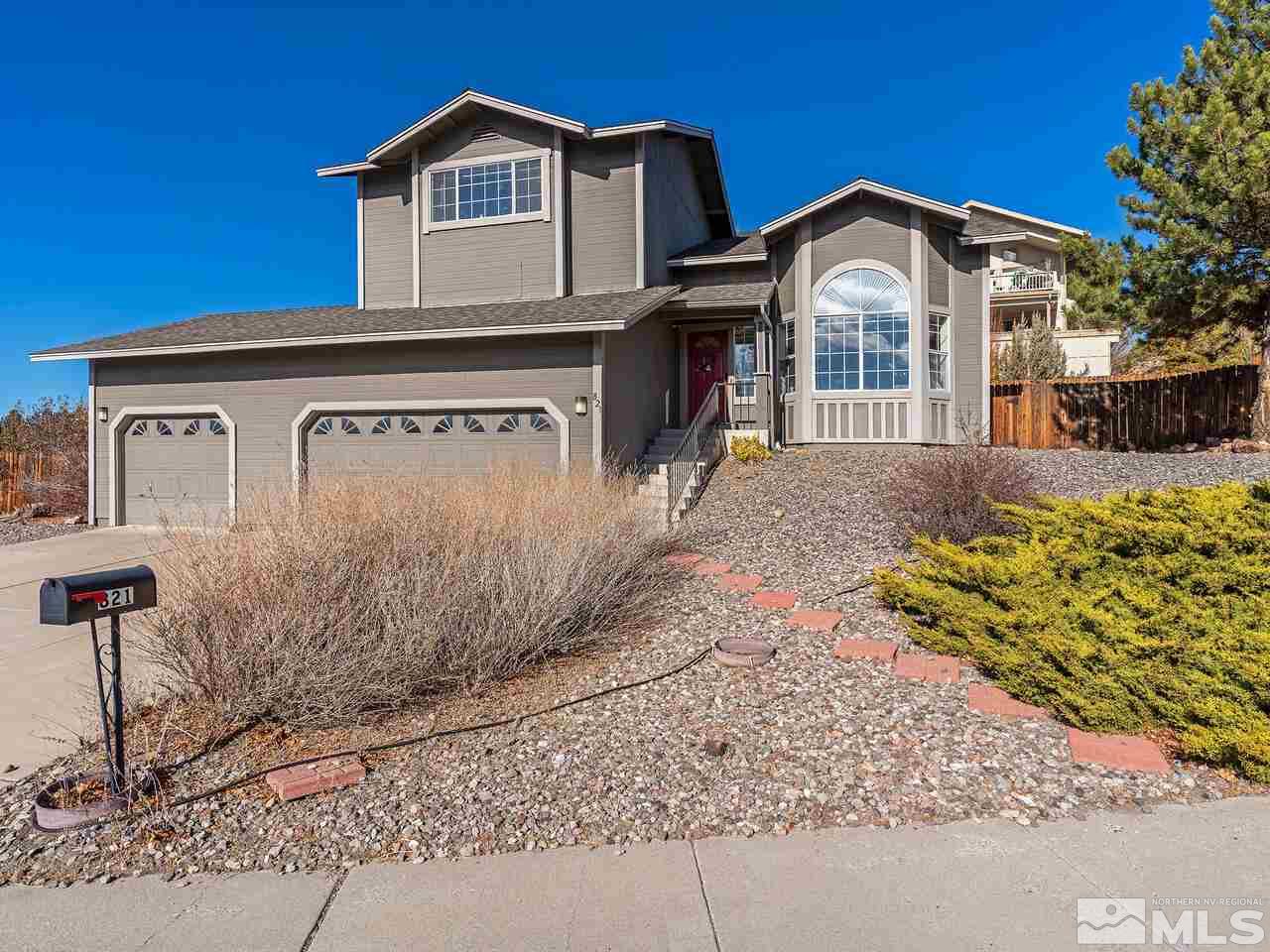 821 University Ridge Drive Reno, NV 89512 - Photo 3 of 28 a front view of a house with a yard