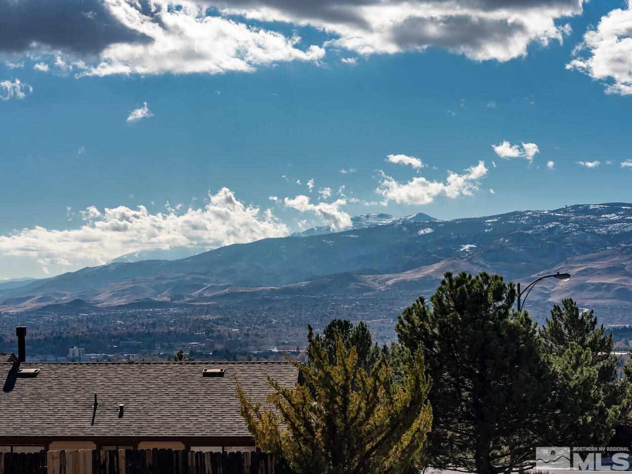 821 University Ridge Drive Reno, NV 89512 - Photo 8 of 28 a view of a balcony with an outdoor space and a yard
