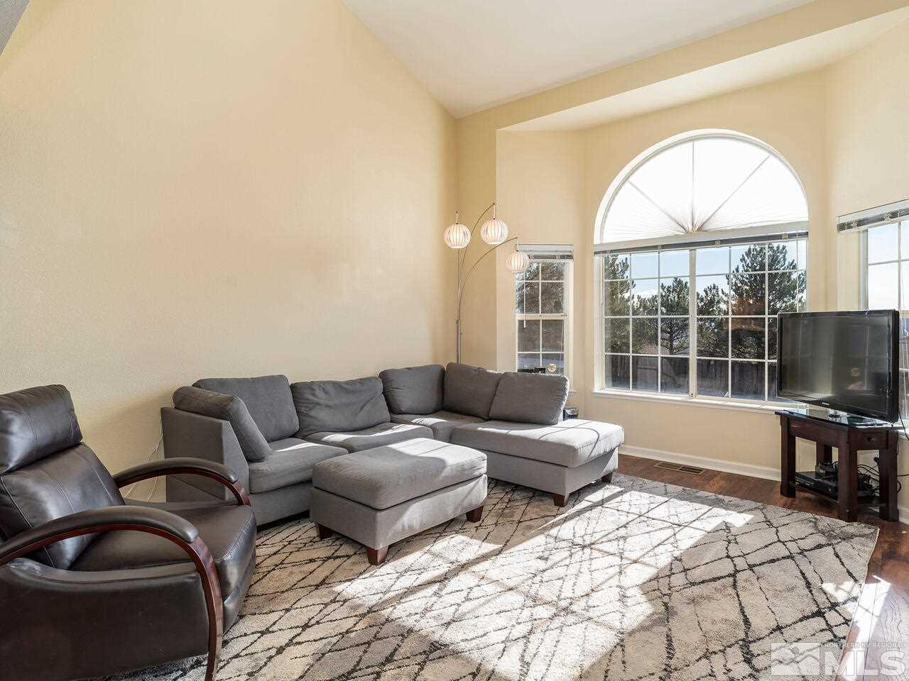 821 University Ridge Drive Reno, NV 89512 - Photo 10 of 28 a living room with furniture and a large window
