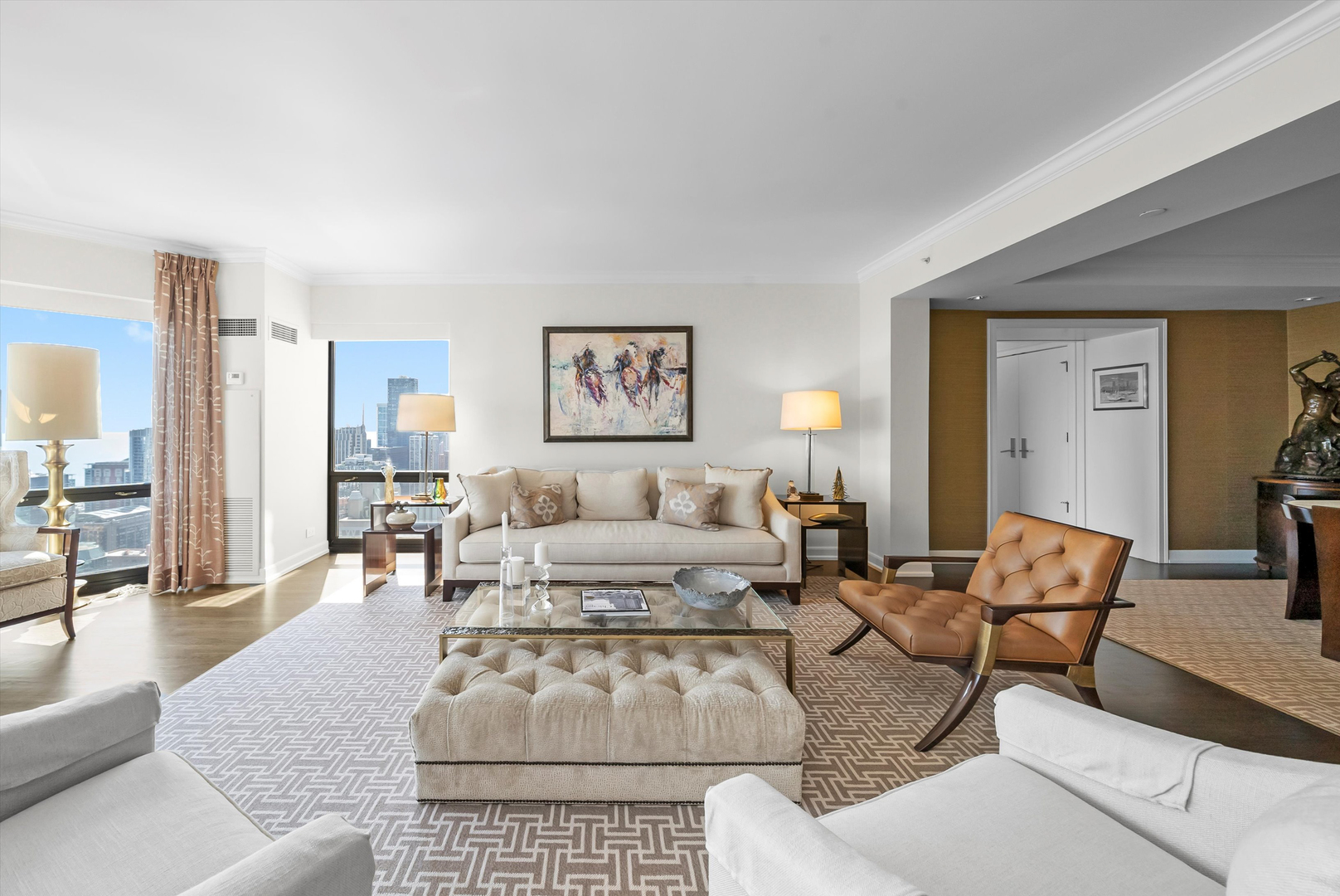 100 East Huron Street, Unit 4503 Chicago, IL 60611 - Photo 13 of 50 a living room with furniture or couch and a table