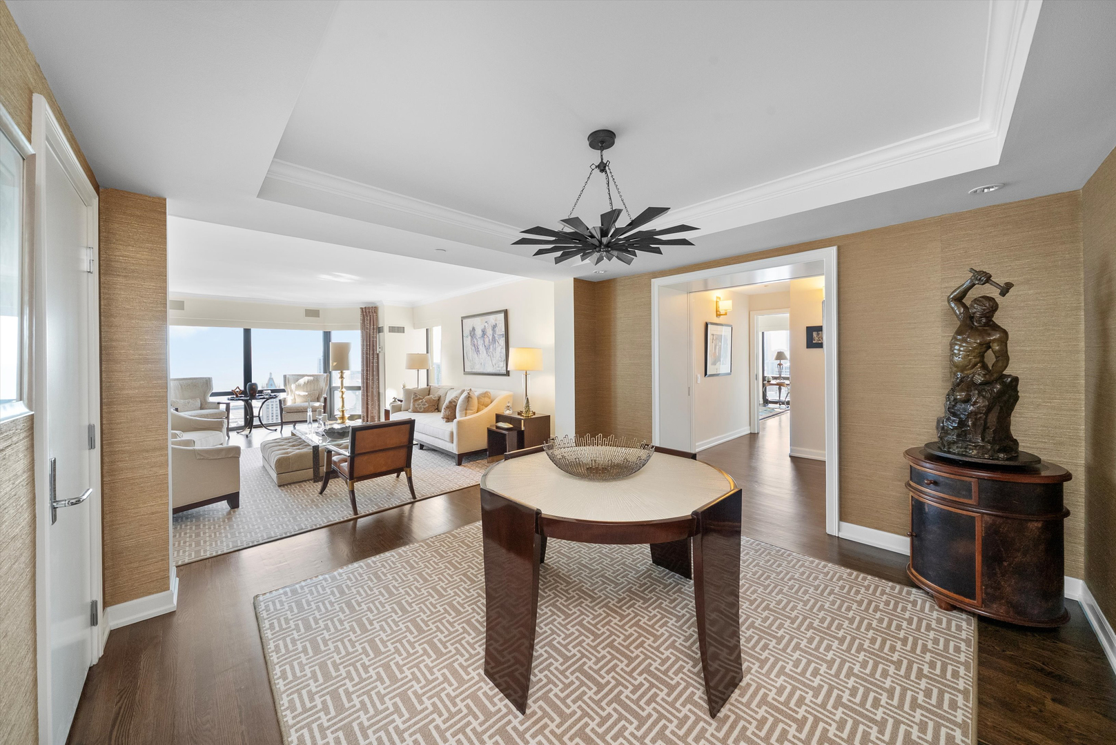 100 East Huron Street, Unit 4503 Chicago, IL 60611 - Photo 16 of 50 a living room with furniture a table and kitchen view