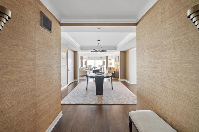 a dining room with furniture and window