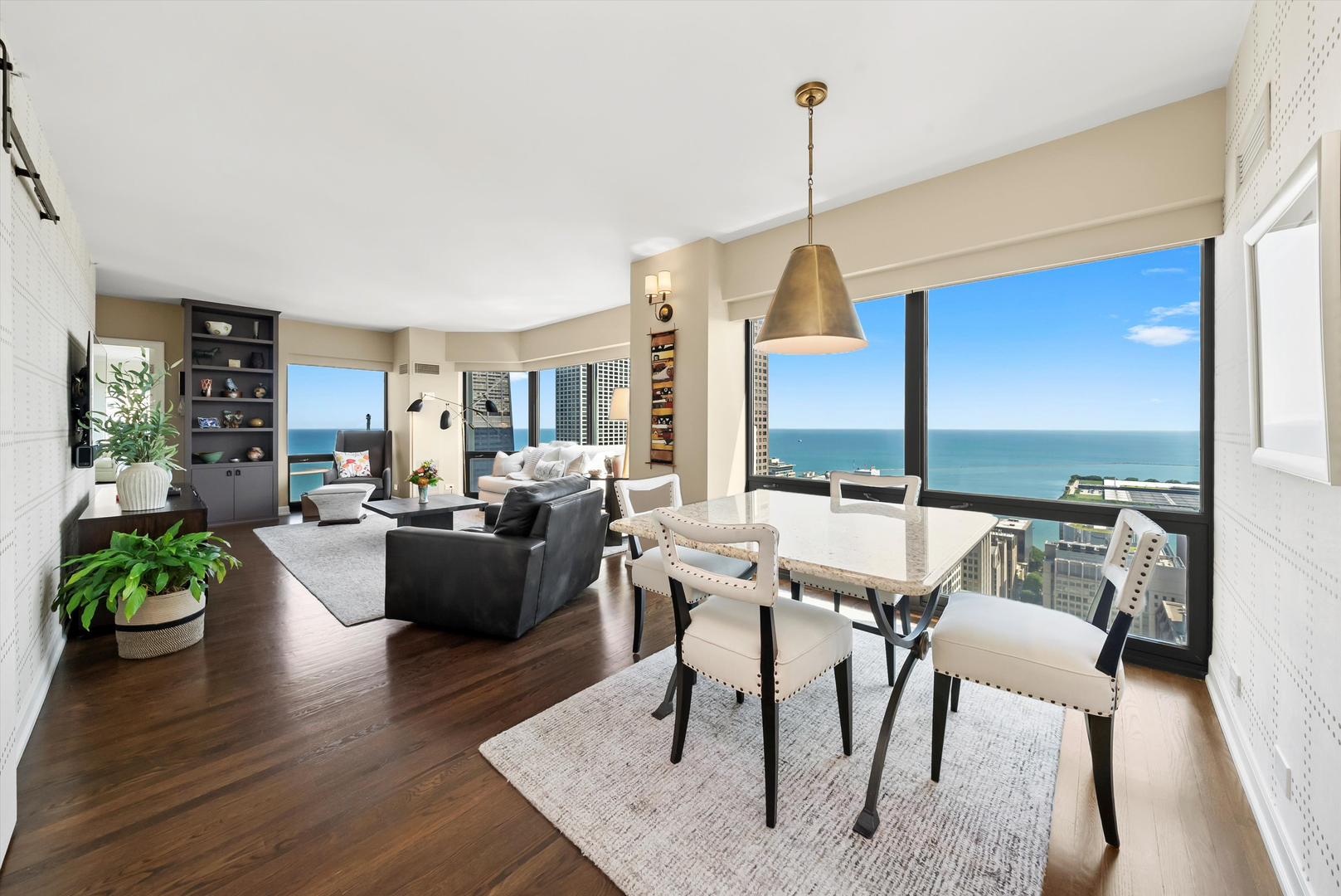 100 East Huron Street, Unit 4503 Chicago, IL 60611 - Photo 18 of 50 a view of a dining room with furniture window and wooden floor