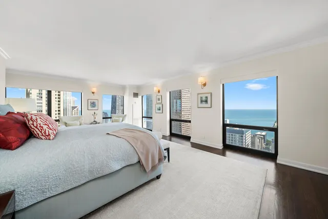 a bedroom with a bed and a couch