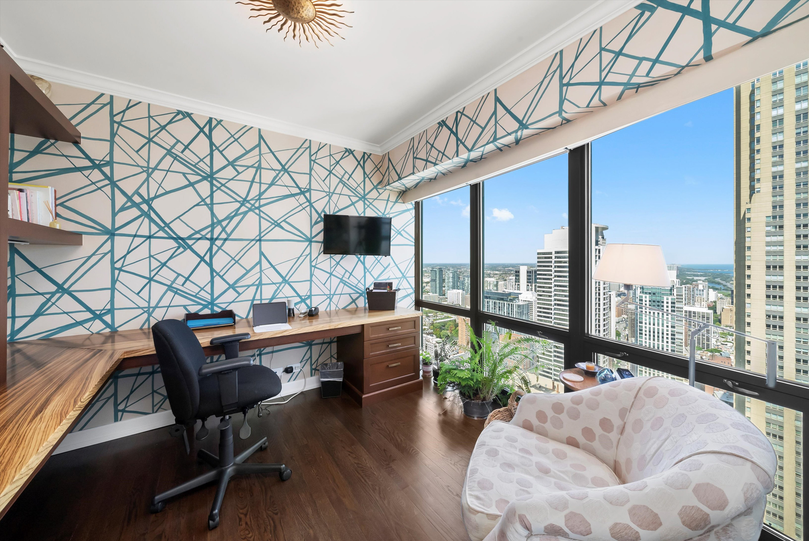 100 East Huron Street, Unit 4503 Chicago, IL 60611 - Photo 35 of 50 a living room with furniture a floor to ceiling window and wooden floor