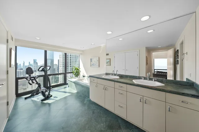 a view of a livingroom with workspace and a window