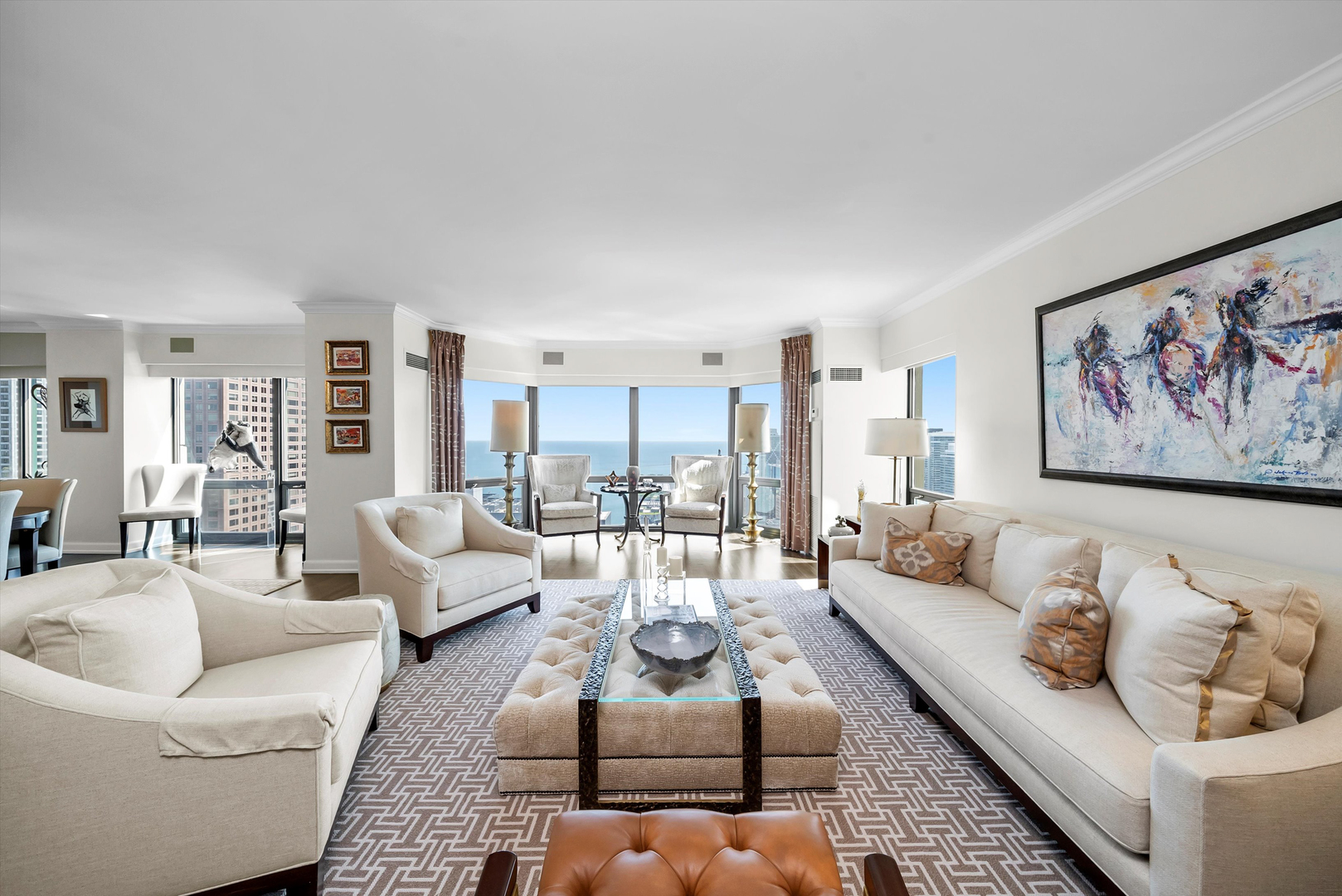 100 East Huron Street, Unit 4503 Chicago, IL 60611 - Photo 9 of 50 a living room with furniture potted plant and a rug
