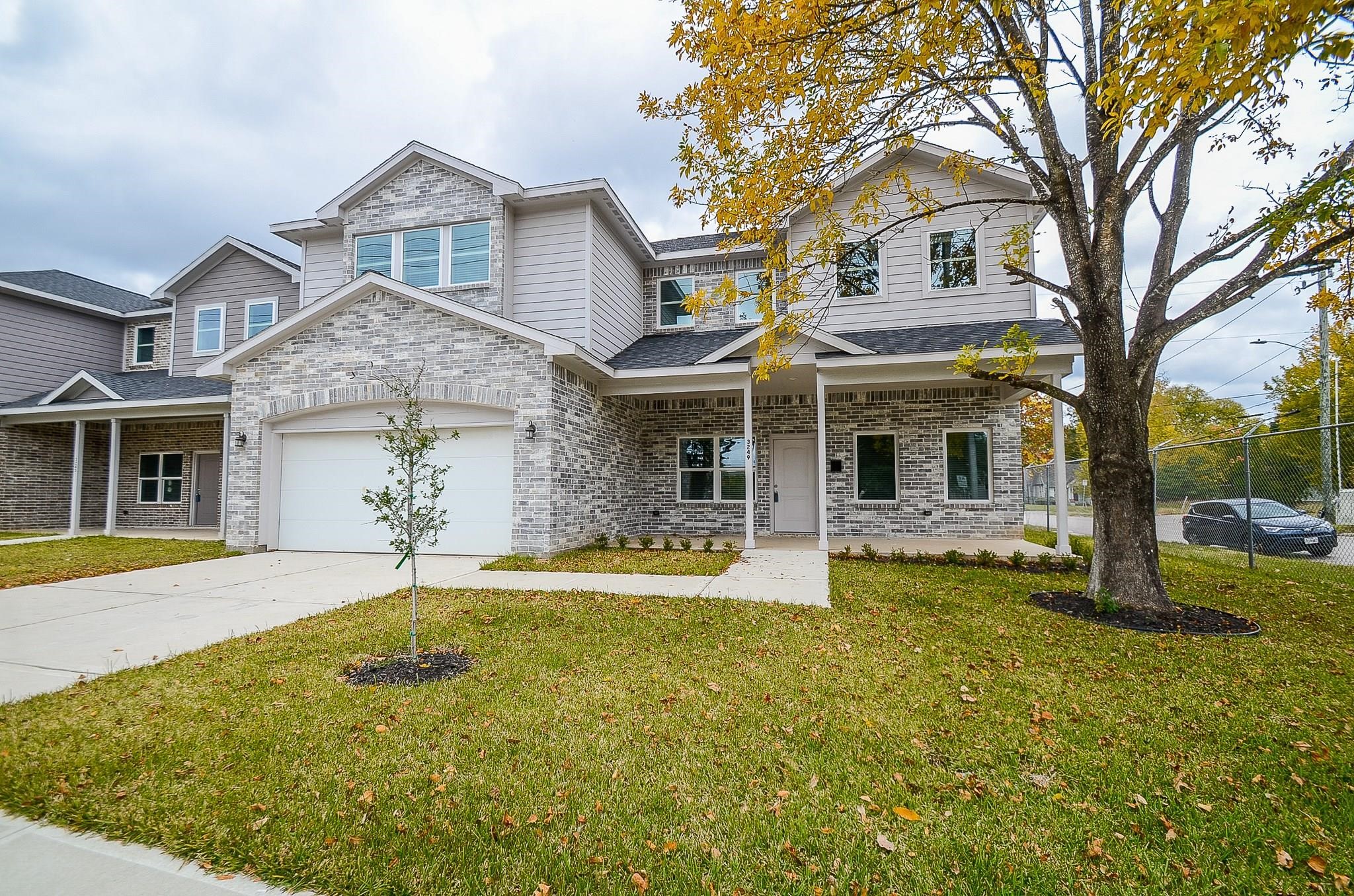 a front view of a house with swimming pool and porch