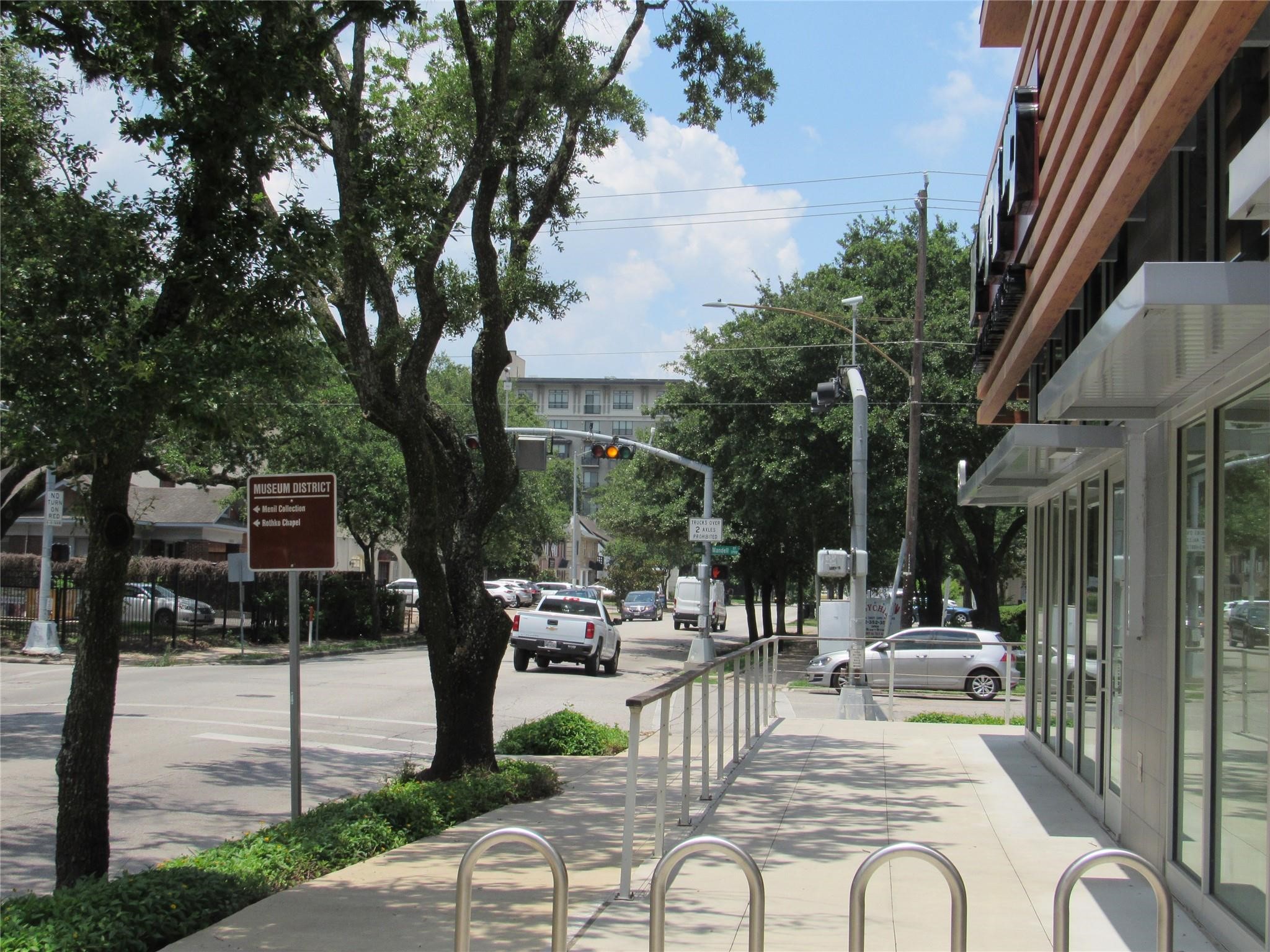 3249 Dixie Drive, Unit B Houston, TX 77021 - Photo 7 of 8 a view of a patio with dining table and chairs with a fire pit