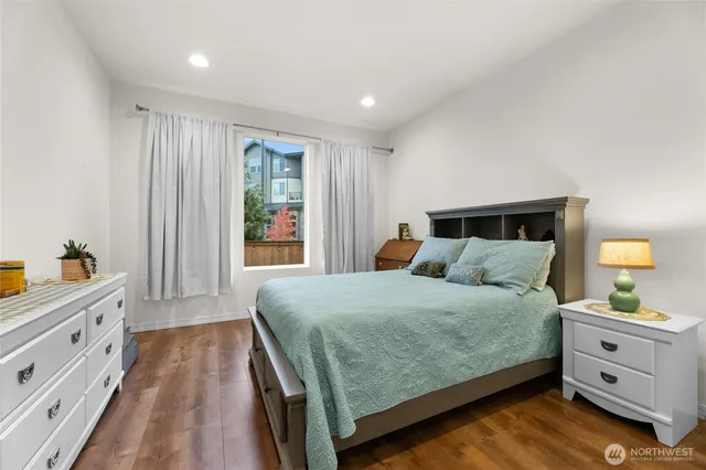 a bedroom with a bed and a dresser