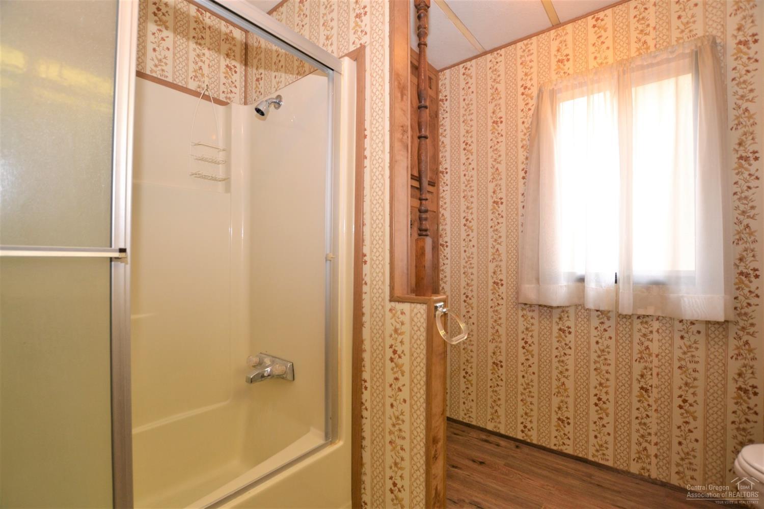 60176 Agate Road Bend, OR 97702 - Photo 14 of 21 a bathroom with a shower