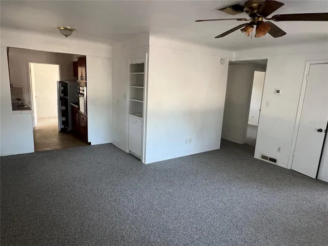 a view of empty room with closet